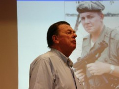 Galloway speaking to Army Reserve officers in San Diego, with a shot of the young war reporter over his shoulder. The picture was taken summer 1965, in Danang, by Steve Northup.