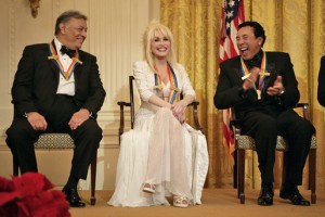 Conductor Zubin Mehta laughs with singers Dolly Parton and William "Smokey" Robinson during a reception for the Kennedy Center honorees in the East Room Sunday, Dec. 3, 2006. White House photo by Eric Draper.