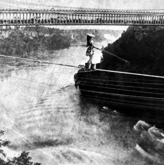 Would you do this without a net? Photo credit: George E. Curtis image of Maria Spelterini crossing Niagara Falls. Source: Wikipedia.