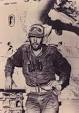 Gen. Israel Tal of the Israel Defense Forces, before a Merkava tank which he designed